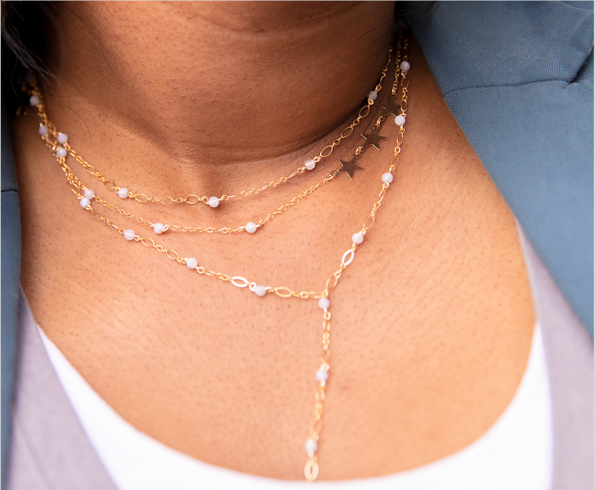 beaded necklace on girl with two other necklaces