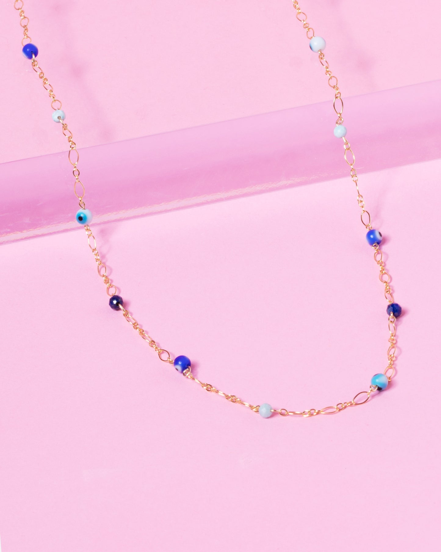 evil eye beads and gemstones on gold chain