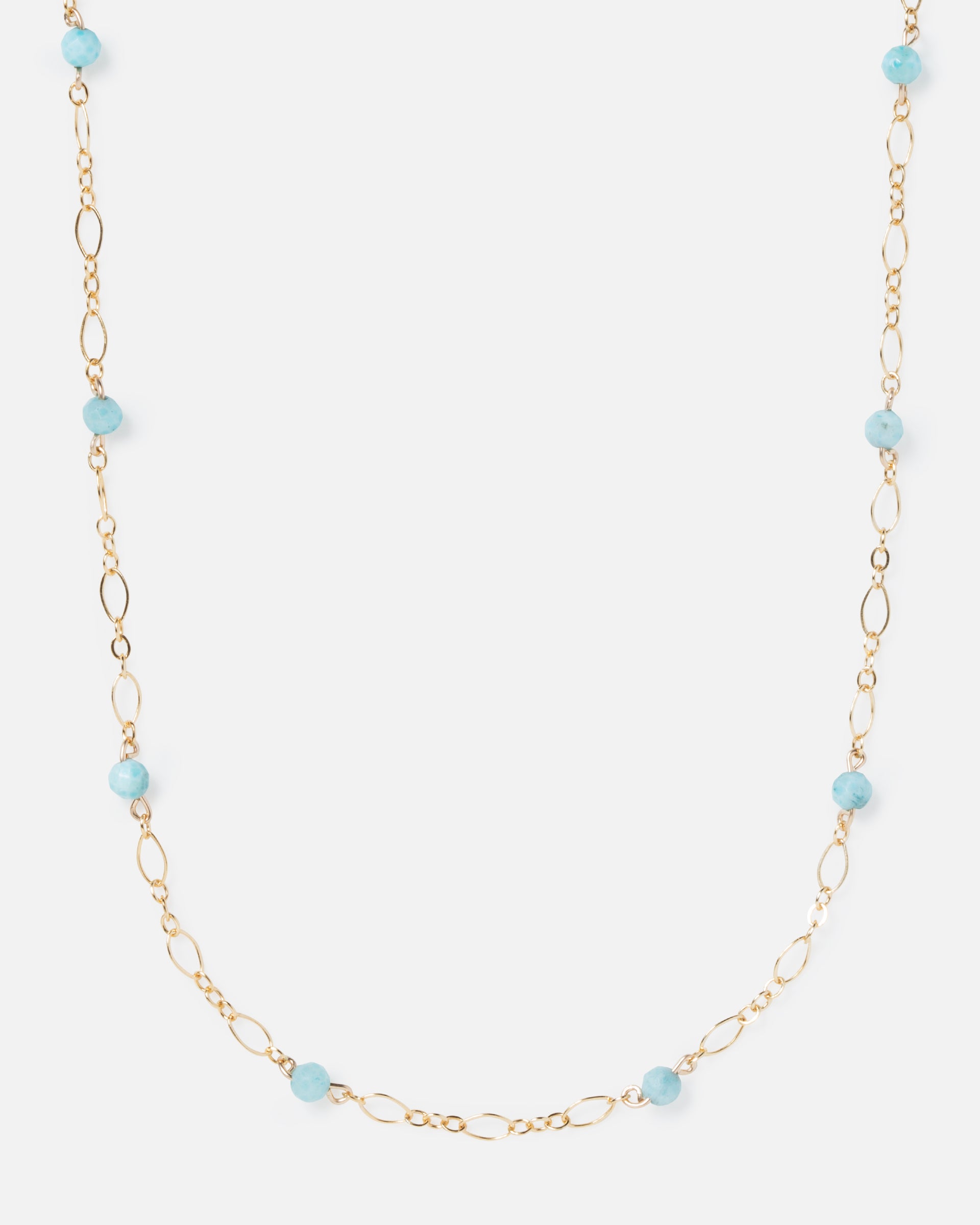 larimar gemstones on fancy gold necklace