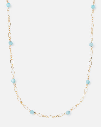 larimar gemstones on fancy gold necklace